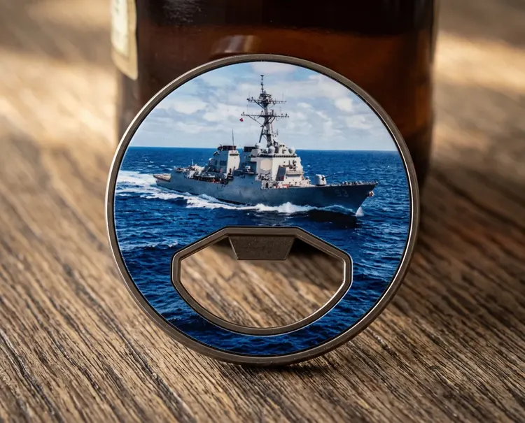 A bottle opener Quick UV coin with an antique nickel rim and a Navy destroyer print