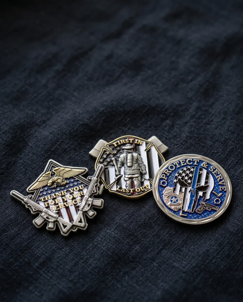 Veterans, firefighter and police sample challenge coins from the shop on dark linen