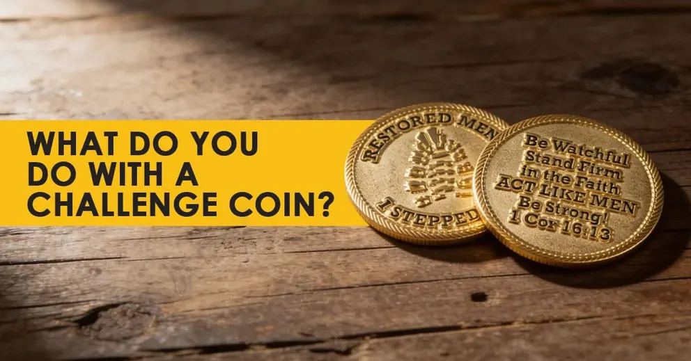 Two brass faith challenge coins on a weathered wooden table